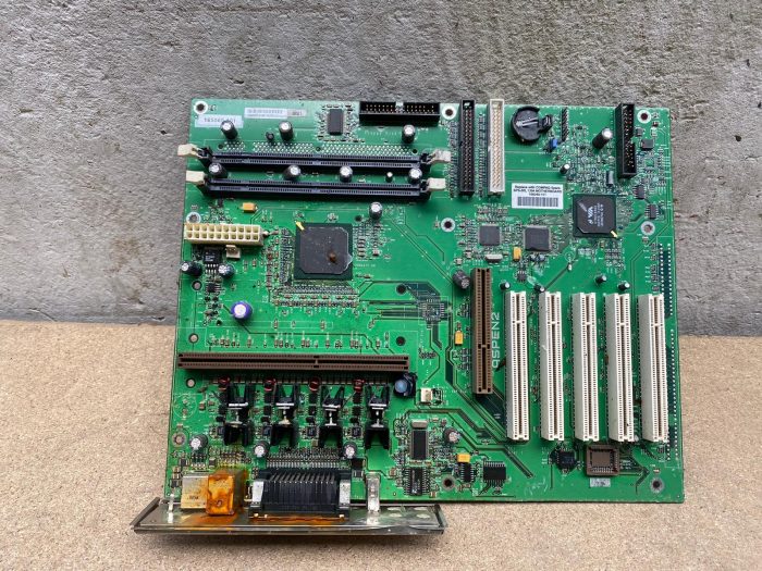 An old motherboard with components, our own stock